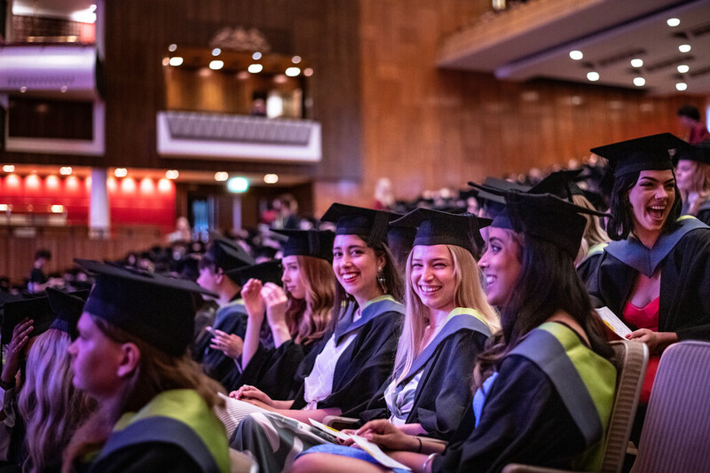 a group of UCA graduands in their seats ahead of the ceremony